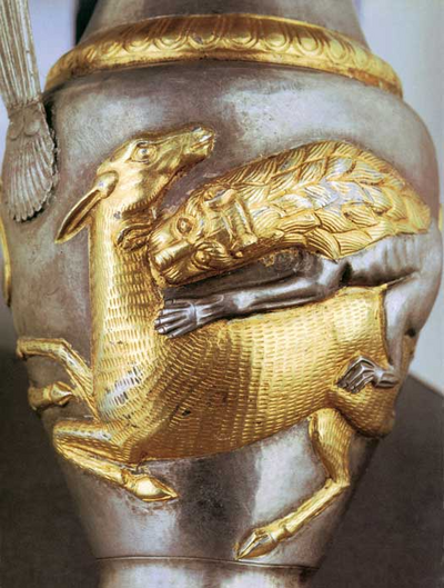 Pitcher of gilded silver from Rogozen, north-western Bulgaria, c. 300 BC. The dear and the lion are shaped in the same fashion as some of the animals on the Gundestrup Cauldron. The dating and origin of the silver cauldron